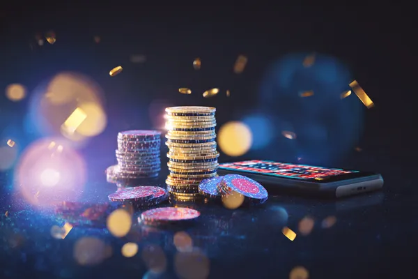 A glowing roulette wheel with cascading chips, symbolizing the engaging live and instant-win games available on DEWA700.